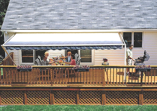  10000XT SunSetter Awnings installed & A family enjoying a meal underneath